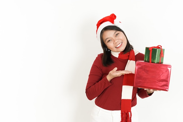 Holding and Showing  Gift of Beautiful Asian Woman Wearing Red Turtleneck and Santa Hat