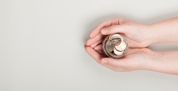 Holding a stack of coins in hands