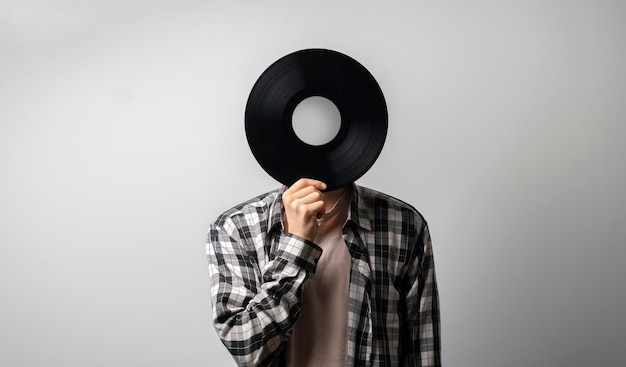 Holding vinyl record disc in front of head