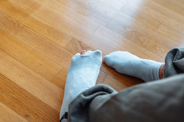 Holey sock on teenagers foot