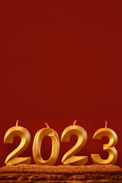 Holiday background Happy New Year Numbers 2023 made by gold candles