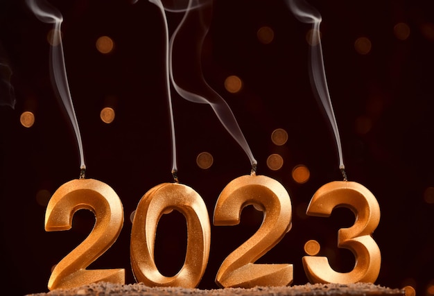 Holiday background Happy New Year Numbers 2023 made by gold candles