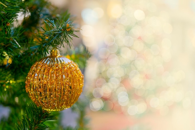 Holiday decorations for the Christmas tree. Blurred holiday background.