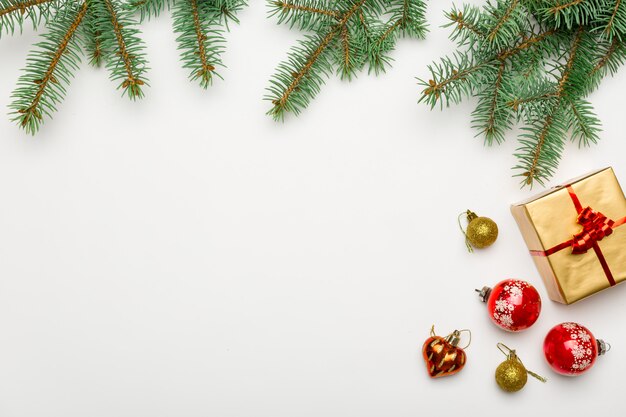 Holiday frame of Christmas decorations on white 