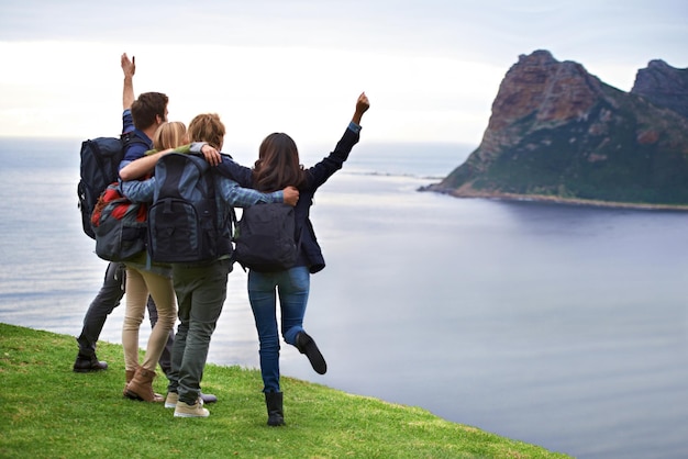 Holiday fun and excitement A group of young people admiring the view together