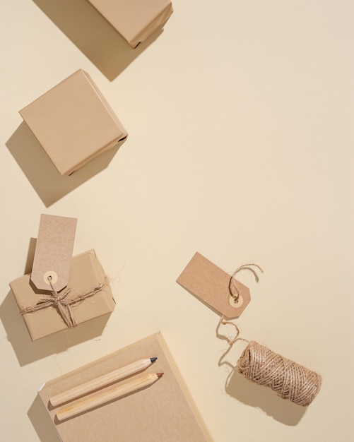 Holiday gift with tag handmade box with present wrapped beige paper Top view and neutral colors