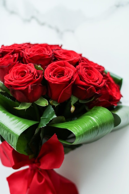 Holiday love present on Valentines Day luxury bouquet of red roses