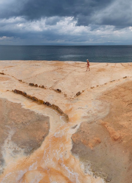 Holiday makers take natural baths at hot springs at a spa resort Loutra Edipsou, island Evia, Greece