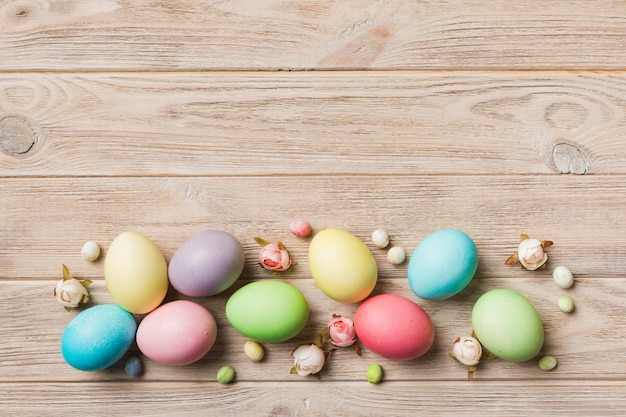 Holiday preparation Multi colors Easter eggs on colored background Pastel color Easter eggs holiday concept with copy space