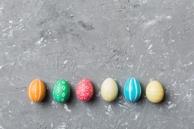 Holiday preparation Multi colors Easter eggs on colored background Pastel color Easter eggs holiday concept with copy space