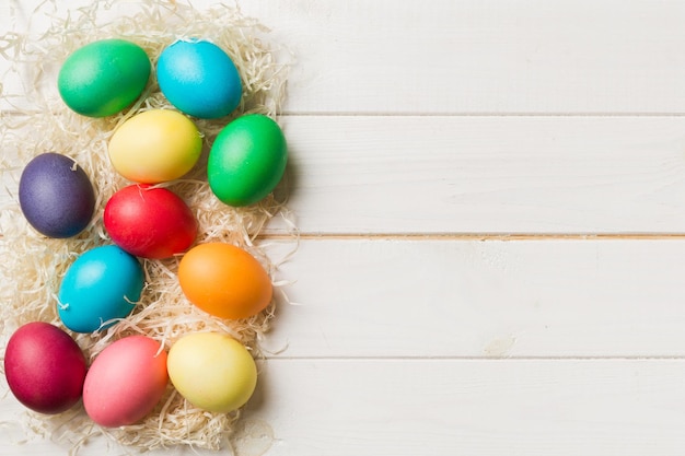 Holiday preparation Multi colors Easter eggs on colored background Pastel color Easter eggs holiday concept with copy space