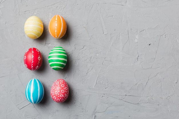 Holiday preparation Multi colors Easter eggs on colored background Pastel color Easter eggs holiday concept with copy space