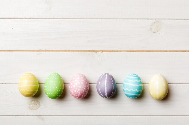 Holiday preparation Multi colors Easter eggs on colored background Pastel color Easter eggs holiday concept with copy space