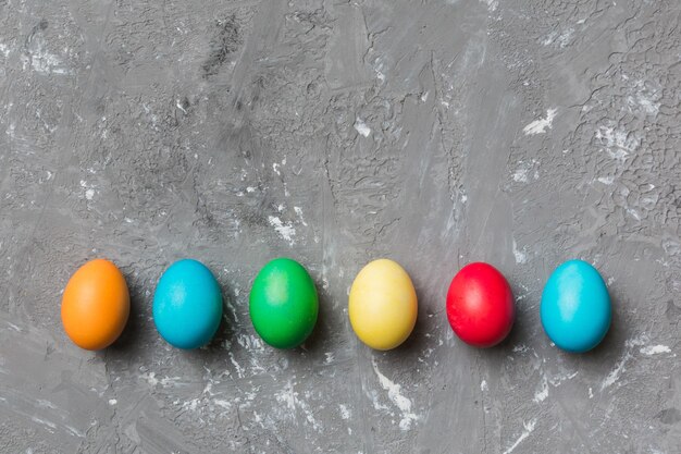 Holiday preparation Multi colors Easter eggs on colored background Pastel color Easter eggs holiday concept with copy space