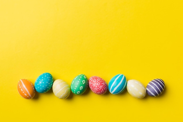 Holiday preparation Multi colors Easter eggs on colored background Pastel color Easter eggs holiday concept with copy space