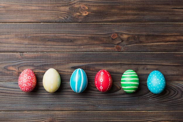 Holiday preparation Multi colors Easter eggs on colored background Pastel color Easter eggs holiday concept with copy space