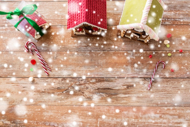 holidays, christmas, baking and sweets concept - closeup of beautiful gingerbread houses at home