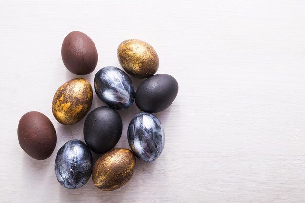 Holidays, design and modern easter concept - Black and brown easter eggs style minimalism on white background with copyspace.