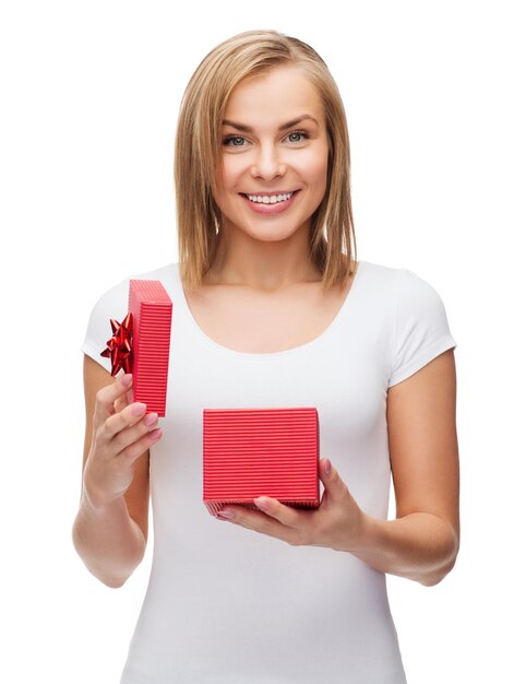 holidays, love and happiness concept - beautiful girl with gift box