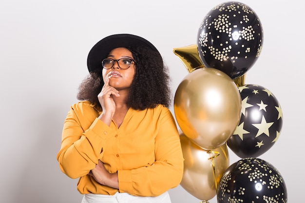 Holidays, party and fun concept - Portrait of smiling young African-American young woman looking