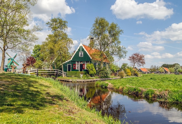 Holland countryside landscape dutch windmills and authentic houses in village Zaanse Schans