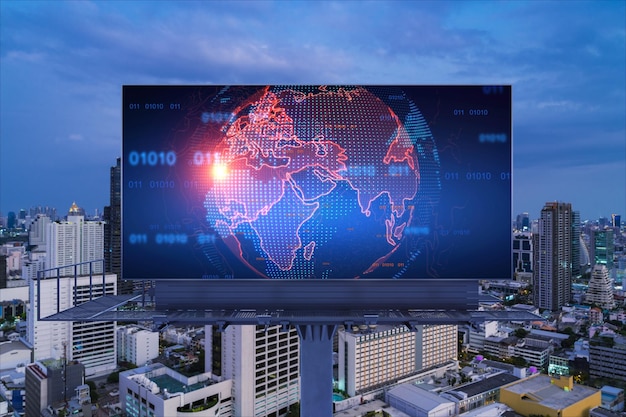 Hologram of Earth planet map on billboard over night panoramic cityscape of Bangkok The concept of international companies in Southeast Asia