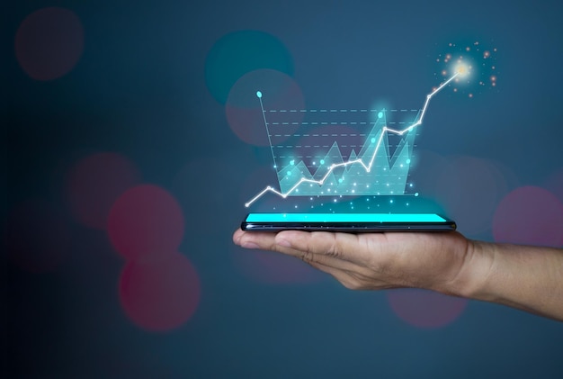 Hologram image of a chart from a phone on a person's hand Offer trading investment ideas