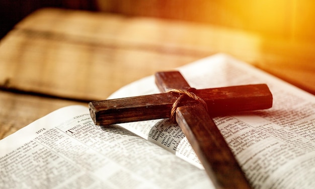 Holy Bible book and cross, close-up view