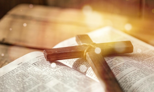 Holy Bible book and cross, close-up view