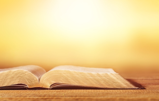 Holy bible book on wooden table