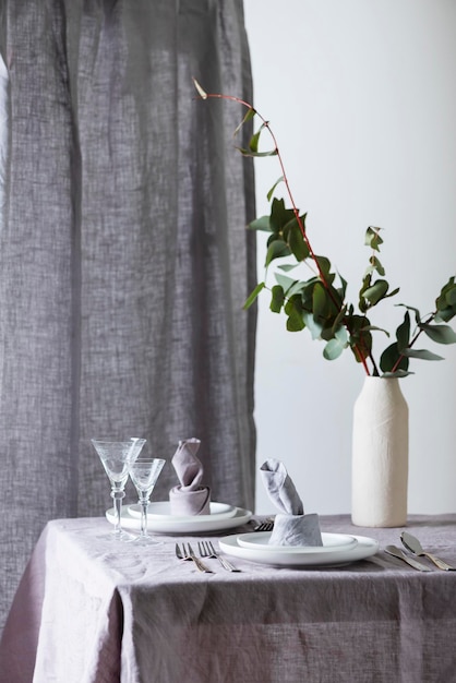 Home decor concept with linen tablecloth and linen napkin selective focus image