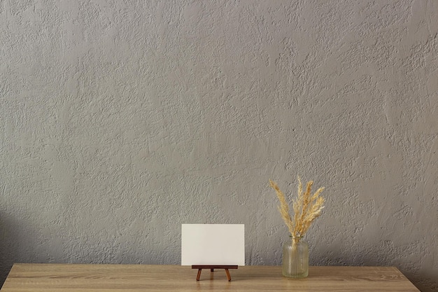 Home decor mockup blank photo frame near gray painted concrete wall Place for your text