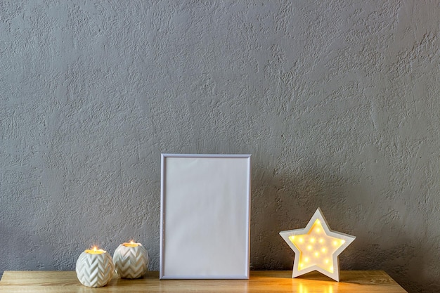 Home decor mockup blank photo frame near gray painted concrete wall Place for your text