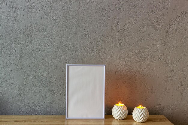 Home decor mockup blank photo frame near gray painted concrete wall Place for your text