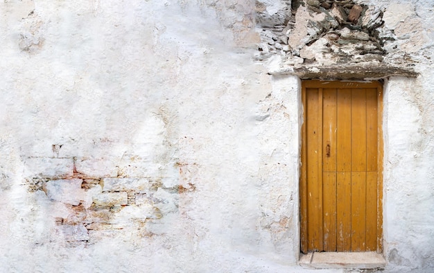 Home entrance door with on white wall copy space Cycladic architecture at Greece