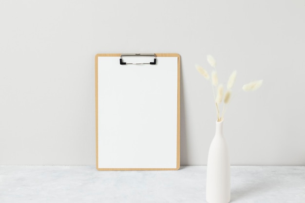 Home interior floral decor, pampas grass on table, Front view, Blank paper cards, Greeting card Mockup. Beautiful white pampas grass in vase on white background