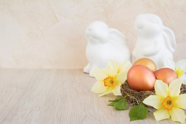 Home interior with easter decor Daffodils spring flowers on a light background Copy space