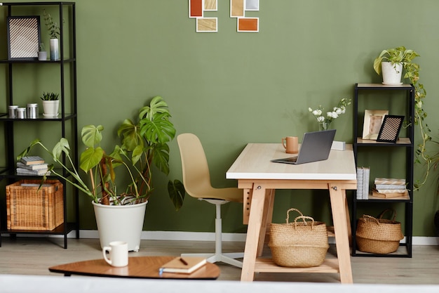 Home interior with workplace with laptop