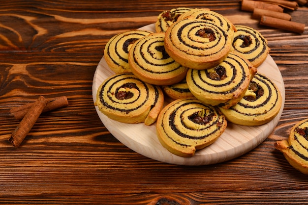 Home made baked cookies with raisins and poppy seeds. Space for text or design.