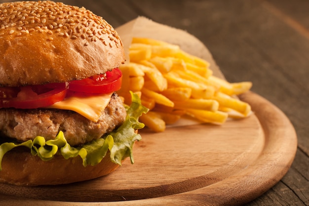 Home made hamburger with beef, onion, tomato, lettuce and cheese. 