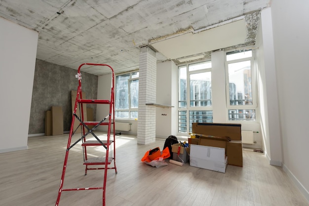 Home renovation in room full of painting tools