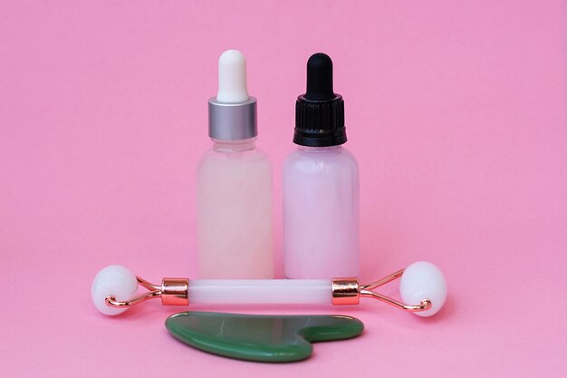 Home spa and personal care products on pink background