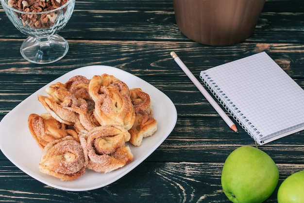 Home workplace Black wooden table Home Office A place for a student with delicious homemade cookies