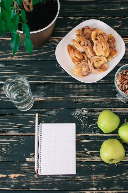 Home workplace Black wooden table Home Office A place for a student with delicious homemade cookies