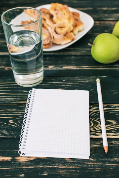 Home workplace Black wooden table Home Office A place for a student with delicious homemade cookies