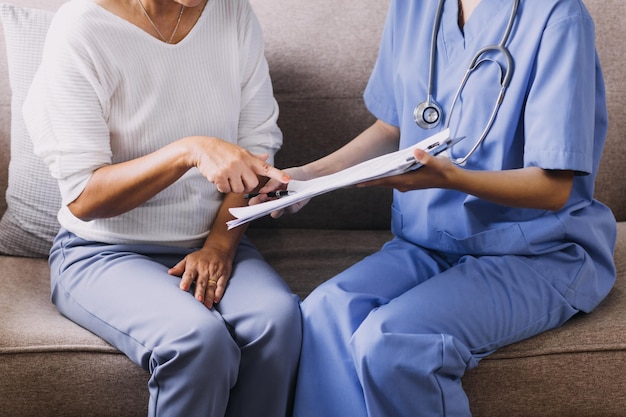 Homecare nursing service and elderly people cardiology healthcare Close up of young hispanic female doctor nurse check mature caucasian man patient heartbeat using stethoscope during visit