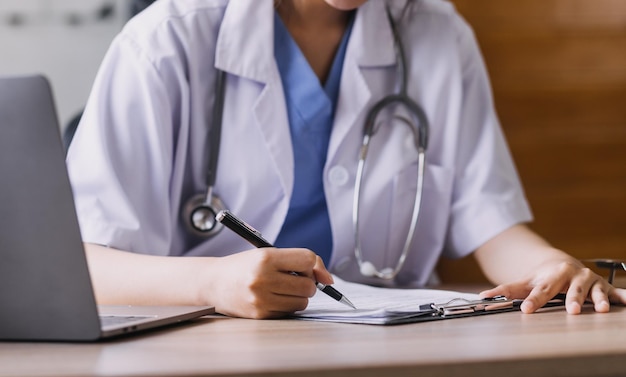 Homecare nursing service and elderly people cardiology healthcare Close up of young hispanic female doctor nurse check mature caucasian man patient heartbeat using stethoscope during visit