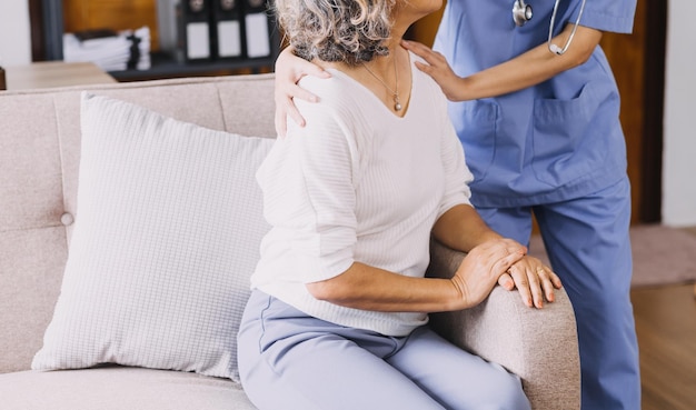 Homecare nursing service and elderly people cardiology healthcare Close up of young hispanic female doctor nurse check mature caucasian man patient heartbeat using stethoscope during visit