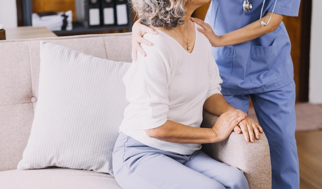 Homecare nursing service and elderly people cardiology healthcare Close up of young hispanic female doctor nurse check mature caucasian man patient heartbeat using stethoscope during visit