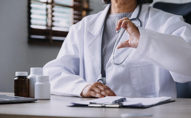 Homecare nursing service and elderly people cardiology healthcare Close up of young hispanic female doctor nurse check mature caucasian man patient heartbeat using stethoscope during visit